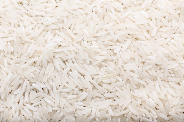 Photo heap of raw rice as background