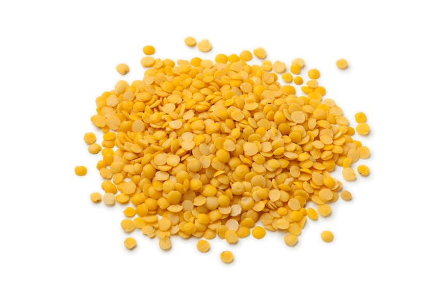 Heap of raw Yellow lentils isolatedon white background close up