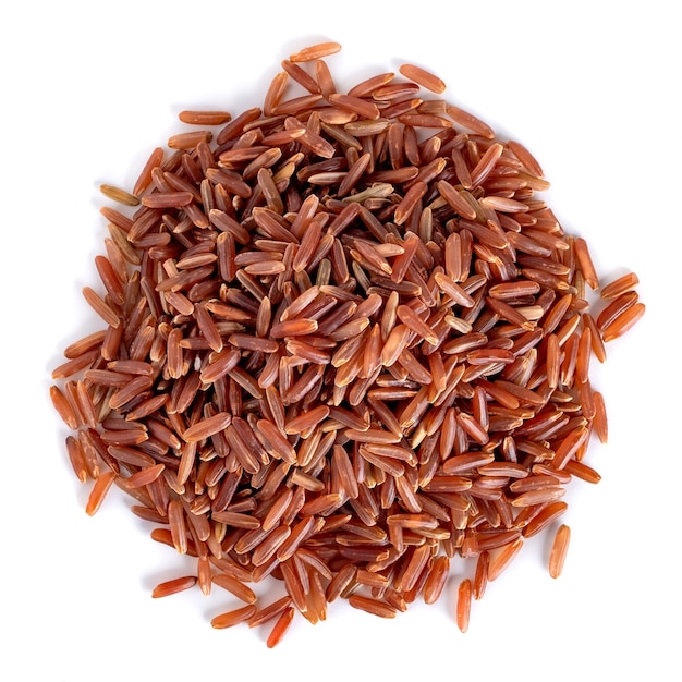 Heap of red rice isolated on white, healthy food