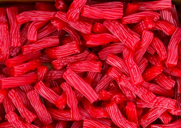 Photo heap of red strawberry licorice candies