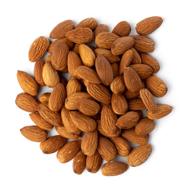 Heap of roasted almonds isolated