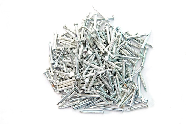 Photo heap of  silver concrete nails isolated on white