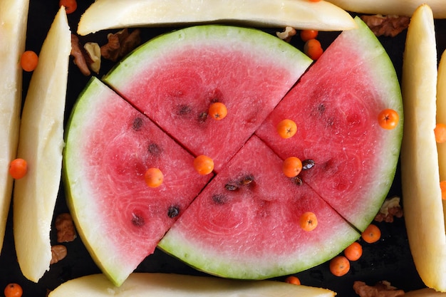Photo heap of slices of watermelon and melon as background fresh watermelon and melon closeup vegetarian healthy food