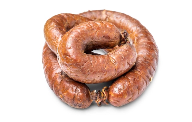 Heap of smoked sausage on white background