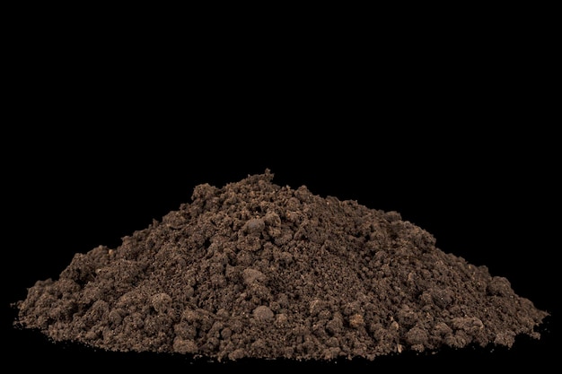 Heap of soil isolated on black background