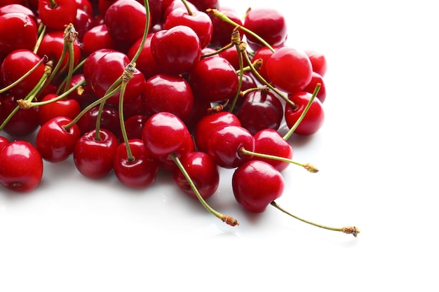 Heap of sweet cherries on white background