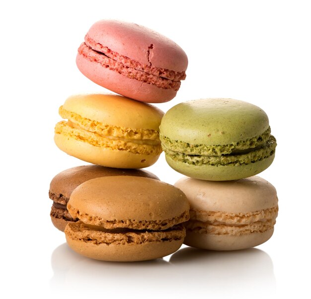 Heap of sweet french macarons isolated on a white background