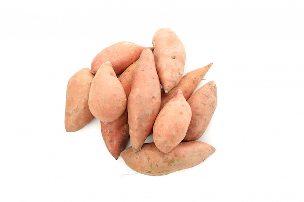 Heap of Sweet potatoes isolated on white surface