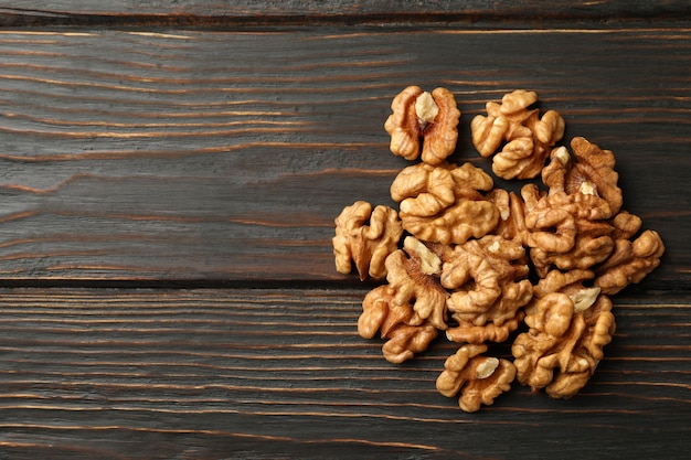 Heap of tasty walnuts on wooden