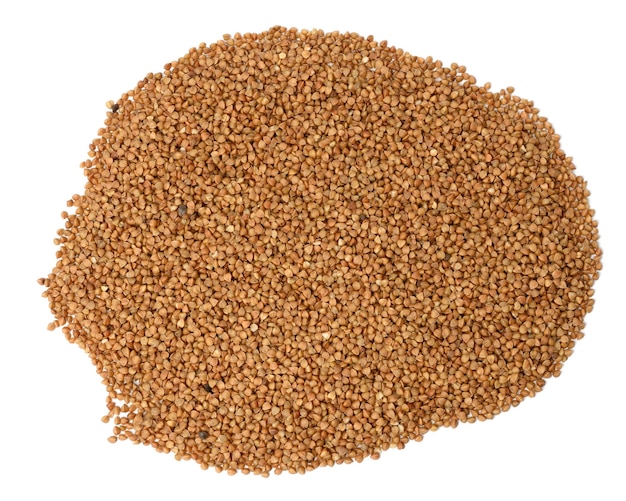 Heap of uncooked buckwheat grains isolated, top view