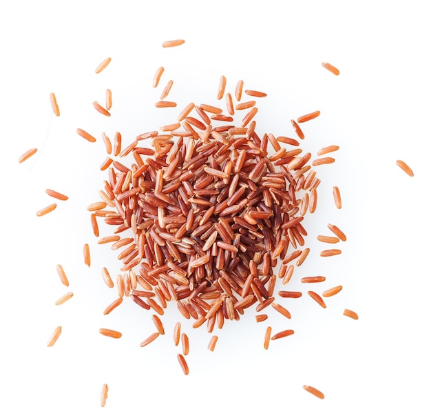 Heap of uncooked red rice isolated on white background