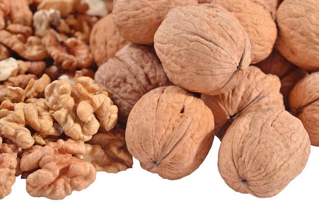 Heap of walnuts on a white background