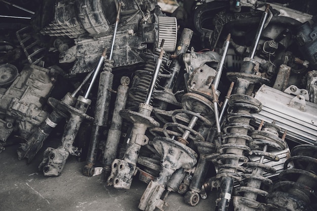 Heap of waste automotive parts in old car service