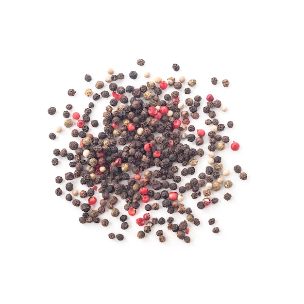 Heap of whole black white green and pink peppercorns