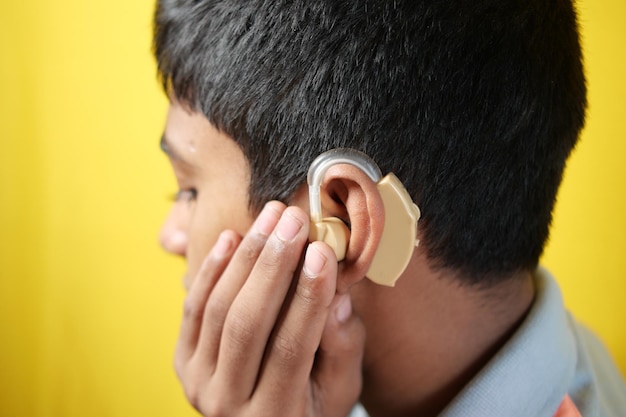 Hearing aid concept teenage boy with hearing problems