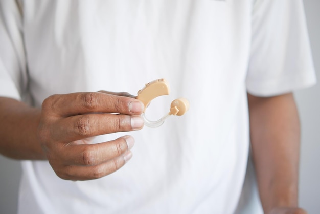 Hearing aid concept a young man with hearing problems