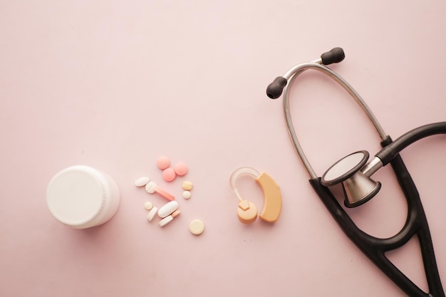 Hearing aid equipment and medical pills on table