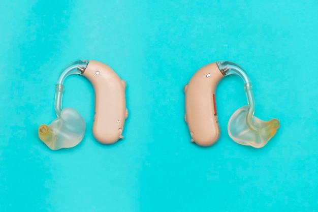 Hearing aid put on Blue background To live in society Front and back