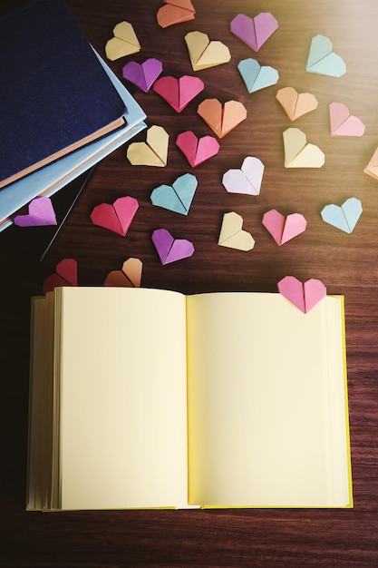 Heart bookmarks for books on wooden background