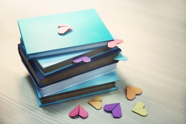 Heart bookmarks for books on wooden table closeup