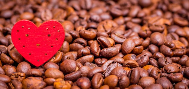 Heart on coffee beans background