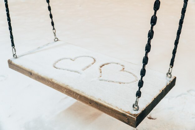 A heart drawn with a finger on the snow