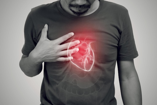 Photo heart failure of asian man on a gray background