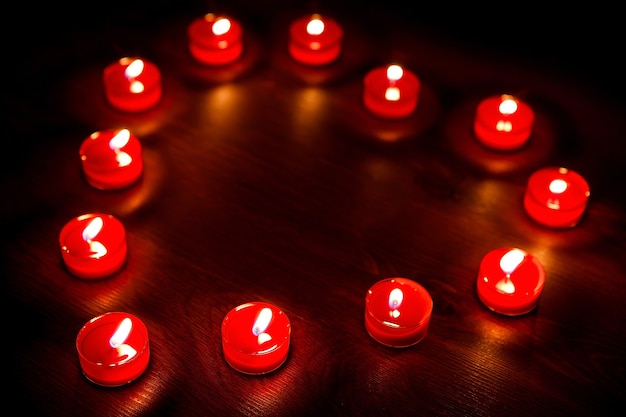 Heart from the lit red candles