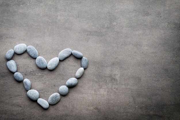 Heart from the spa stones, on the grey  background.