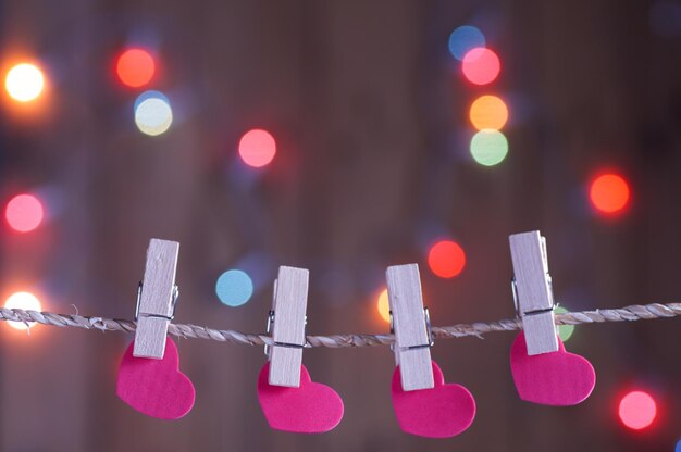 Photo heart holding on rope with blur bokeh background