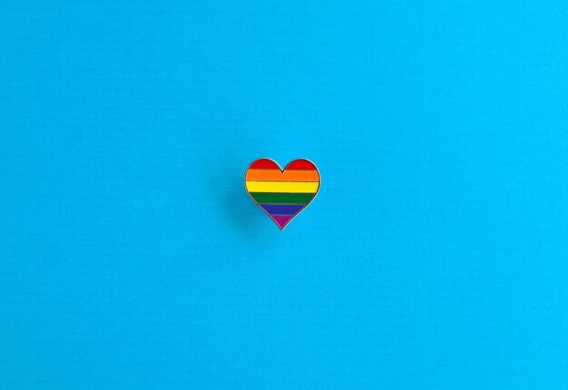 Heart lgbt icon on blue background closeup