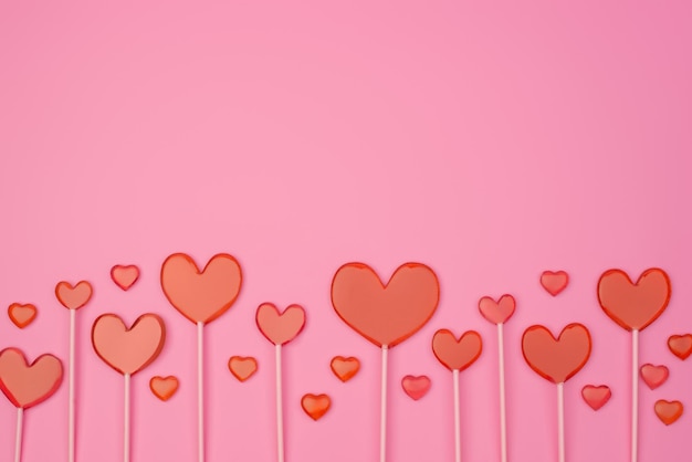 Heart lollipops on a pink background