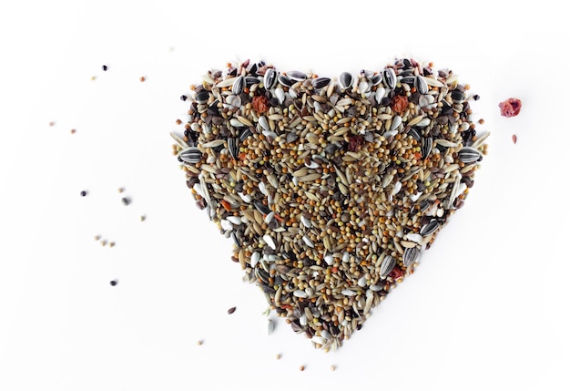 heart made of bird grain isolated 