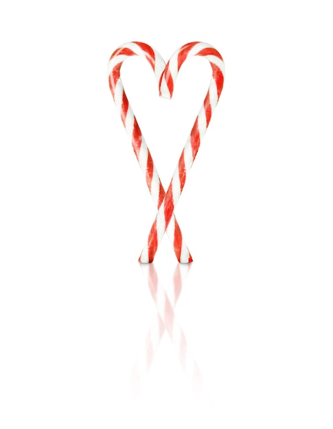 Heart made from Christmas candy cane isolated on white background