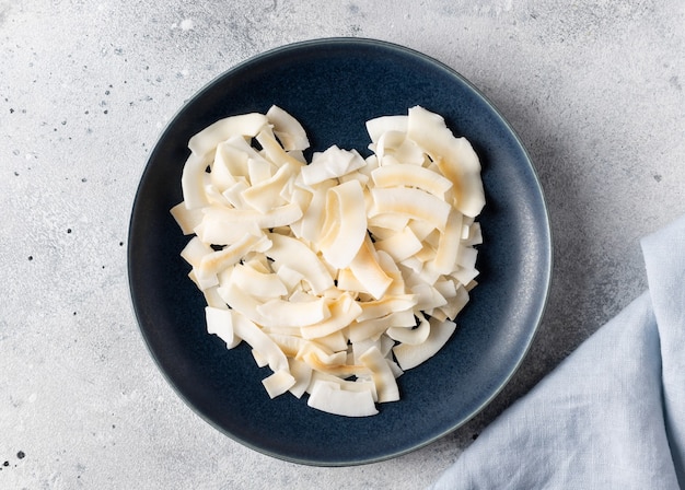 Heart made from coconut chips. vegan food concept