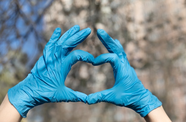 Photo heart made of latex, nitrile medical gloves for doctor and nurse protection