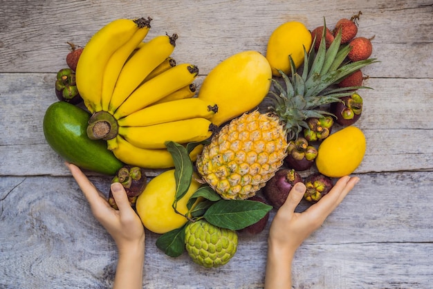 Heart made of many fruits and hands