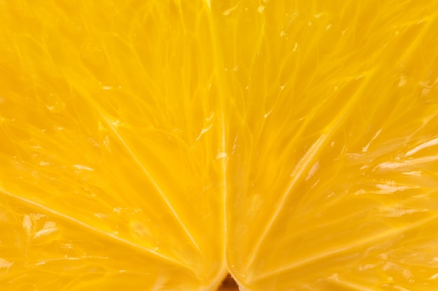 Heart of orange fruit extra close-up in a cut.