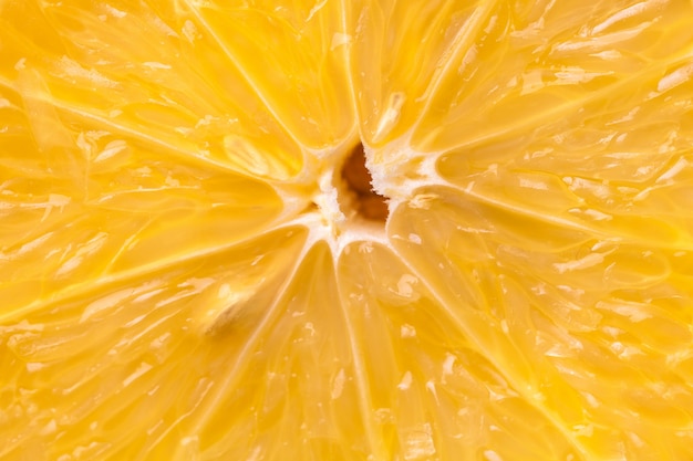 Heart of orange fruit extra close-up in a cut.