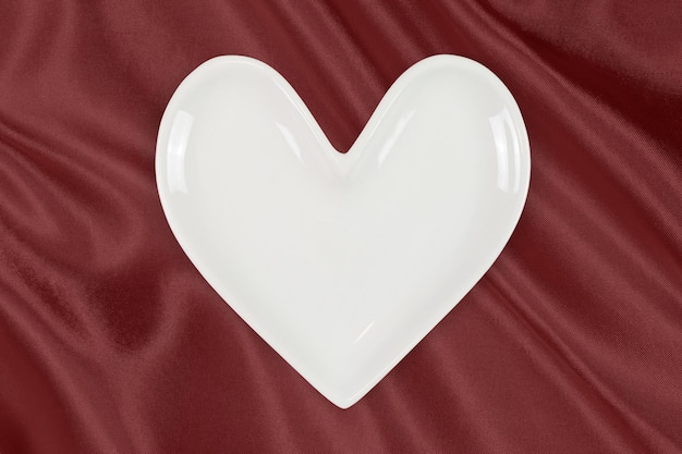 Heart Plate atop Luxurious Red Silk Background