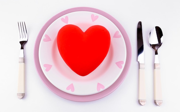 Heart on plate, isolated on white