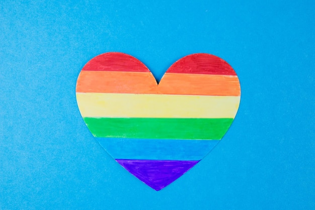 Photo heart in rainbow colors on a blue background lgbt equal rights movement and gender equality concept copy space