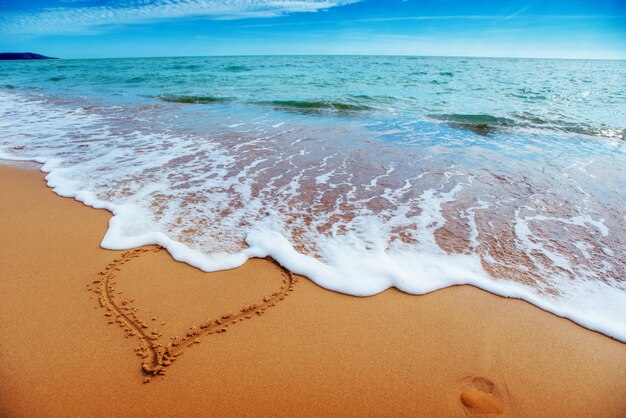 Heart on the sand beach. Romantic composition