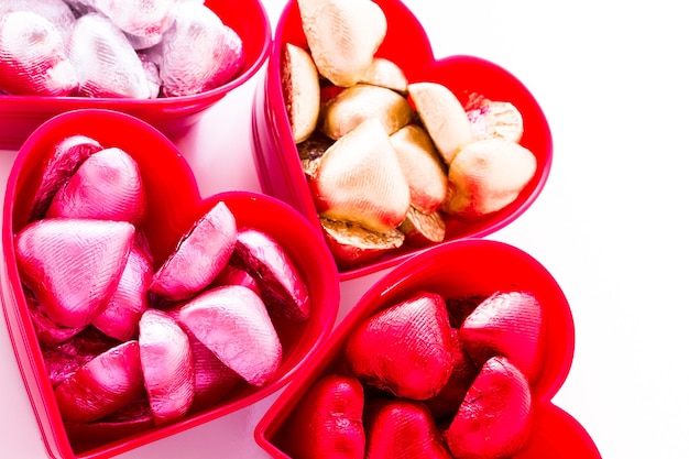 Heart shape chocolate candies wrapped in colorful foil for Valentine's Day.