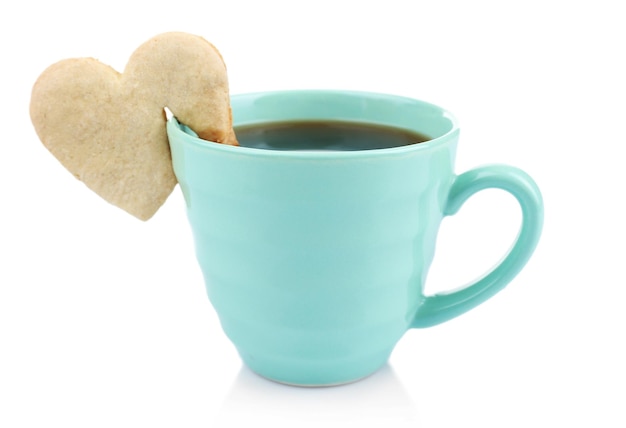 Heart shape cookie on cup of coffee isolated on white