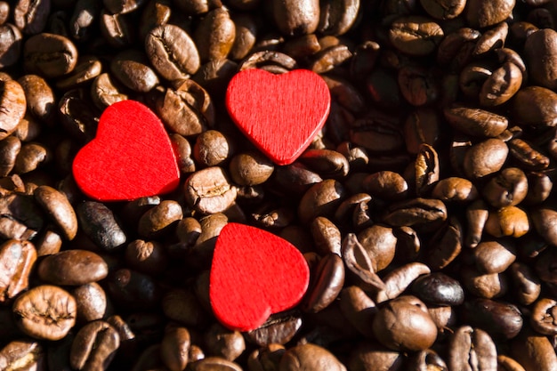 Heart shape decorations on roasted coffee beans