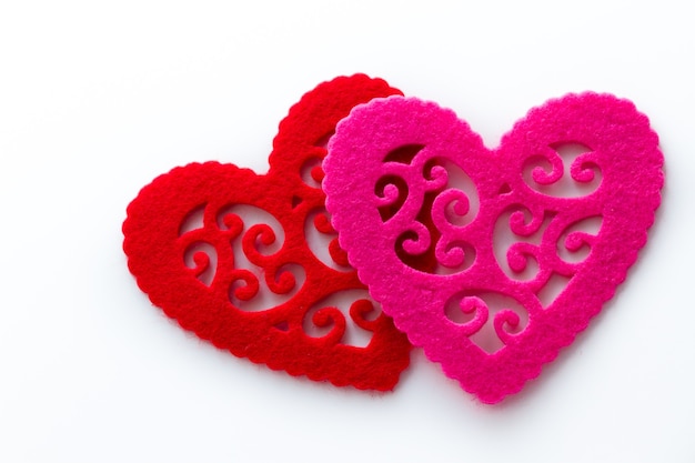 Heart shape doilies on white background.