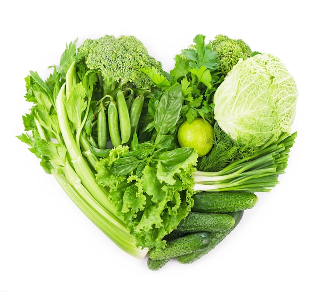 Heart shape form by vegetables isolated on the white background.