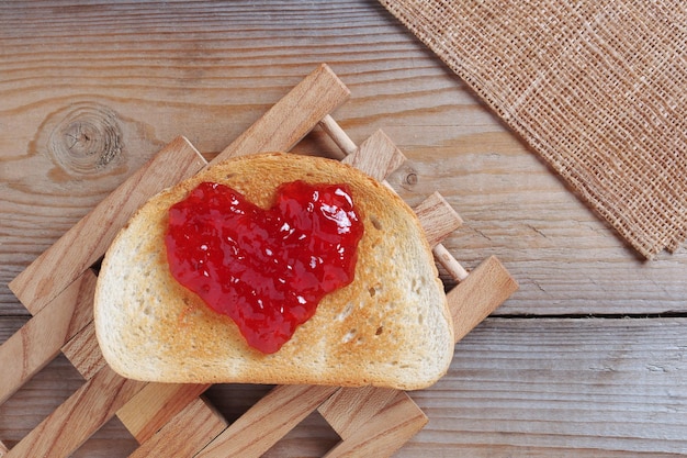 Heart shape jam on bread