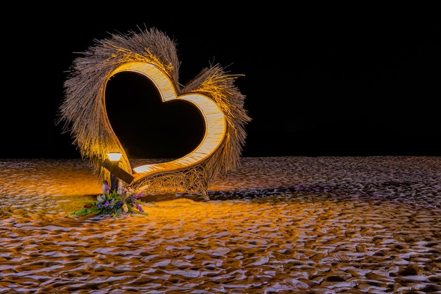 Heart shape and lamp light on the beach